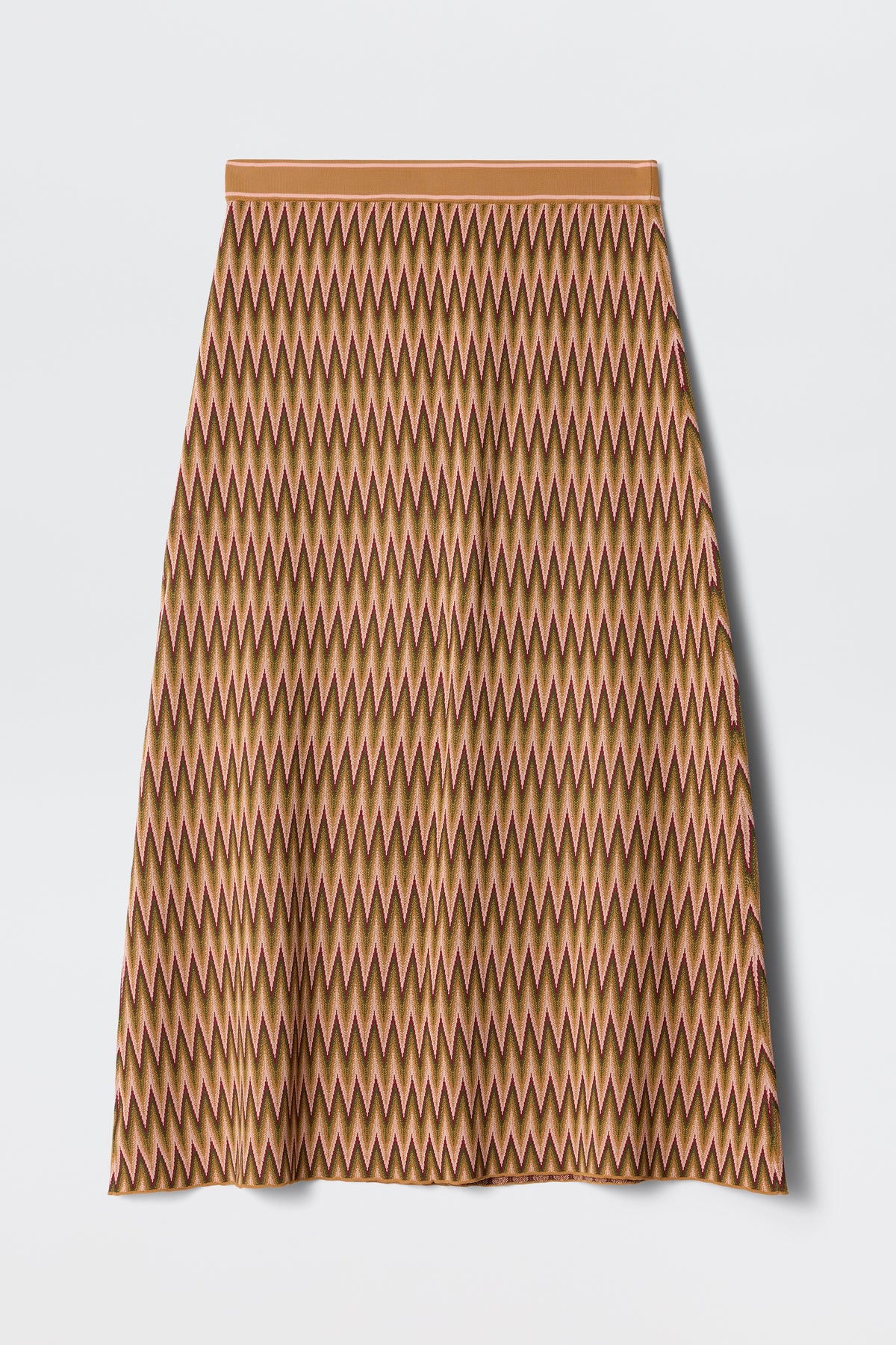 The Brandy - Maeve Jacquard Multi is a knee-length A-line skirt featuring a repeating zigzag pattern in brown, orange, and pink, displayed flat on a white background.