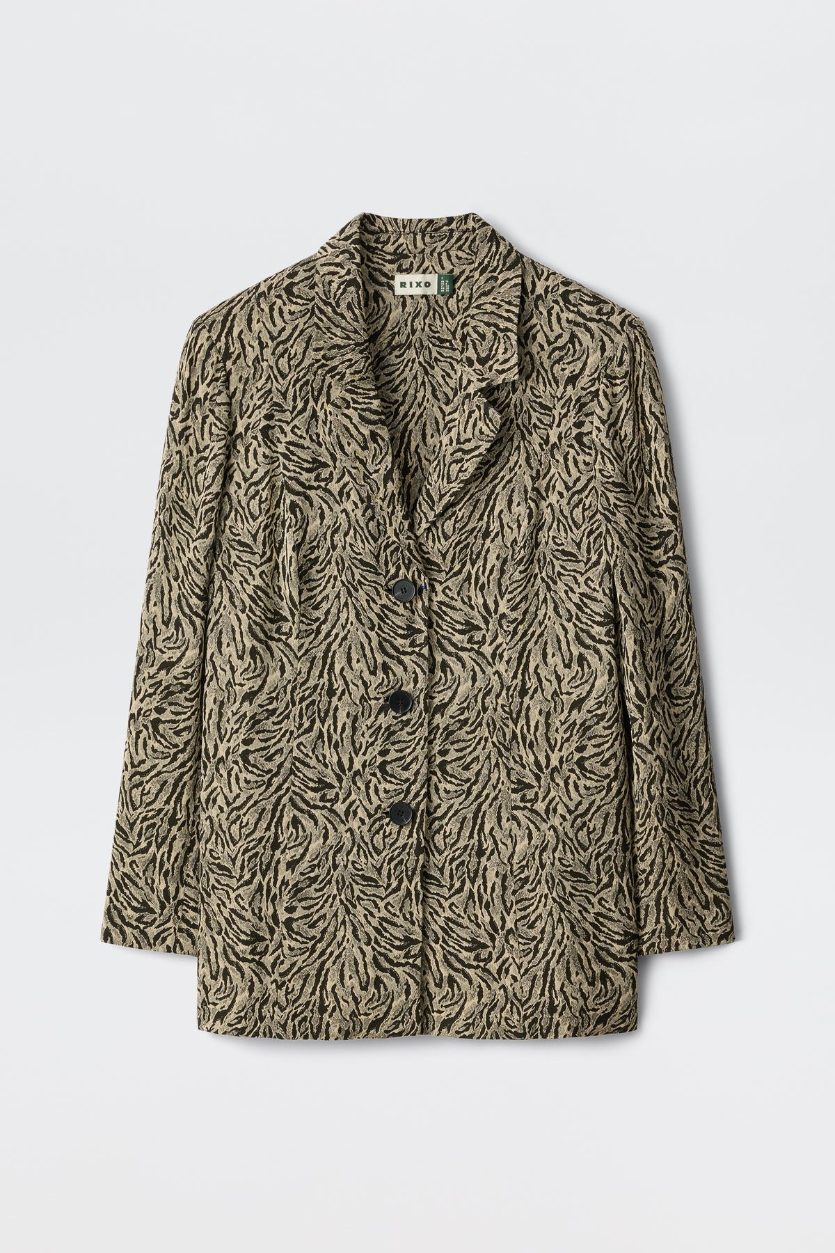 Marselle - Sun Leo Tan features a beige and black leaf-patterned blazer with three black buttons, notched lapels, and long sleeves, showcased on a plain white background.