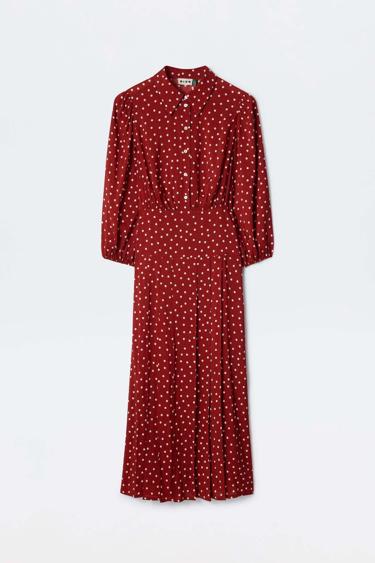 The Izzy - Layla Dot Red is a deep red, long-sleeved midi dress with white polka dots, a button-up front, collared neckline, and a fitted waist.