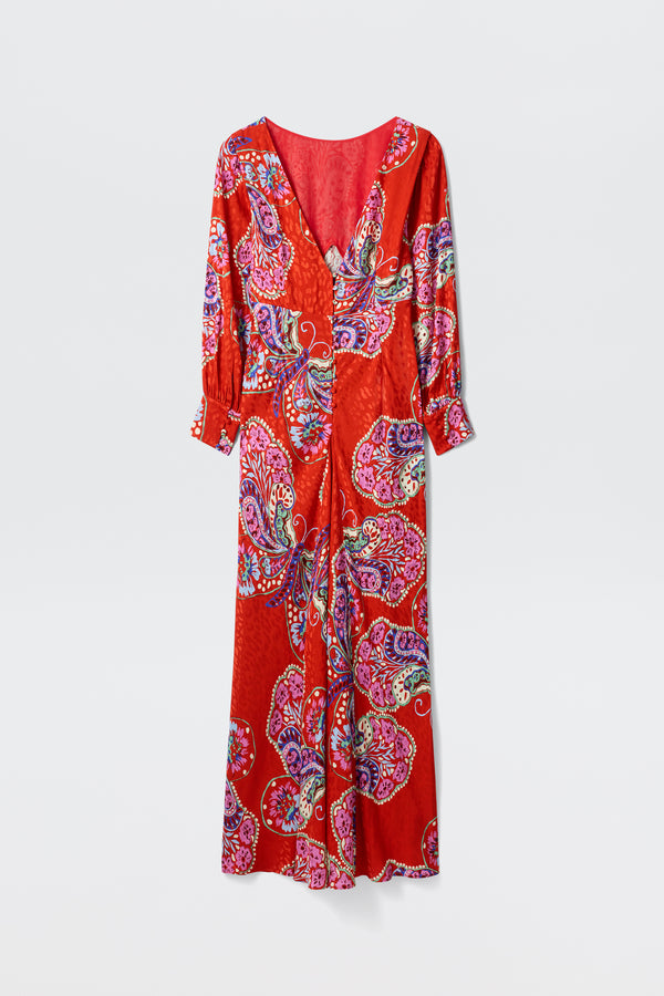 The Marni Butterfly Bloom Jacquard Red dress features a long, relaxed silhouette with a V-neckline, long sleeves, and a vibrant paisley pattern in pink, purple, blue, and white on red. Shown against a plain white background.
