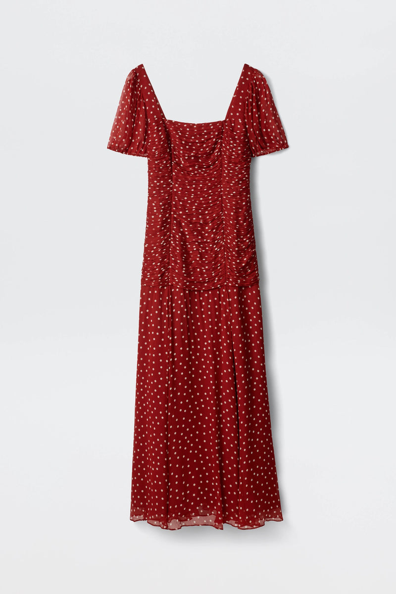 The Leyane - Layla Dot Red is a red, short-sleeved midi dress with white polka dots, a square neckline, and a fitted ruched bodice, shown against a plain white background.