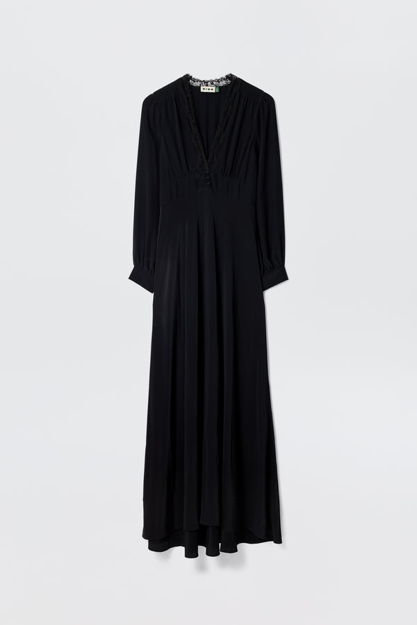 Presenting “Emory - Black”: a long-sleeved, floor-length dress made from luxurious black silk crepe de chine, designed with a V-neckline and subtle waist gathers. Shown against a plain white background, this elegant piece is perfect for special occasions.