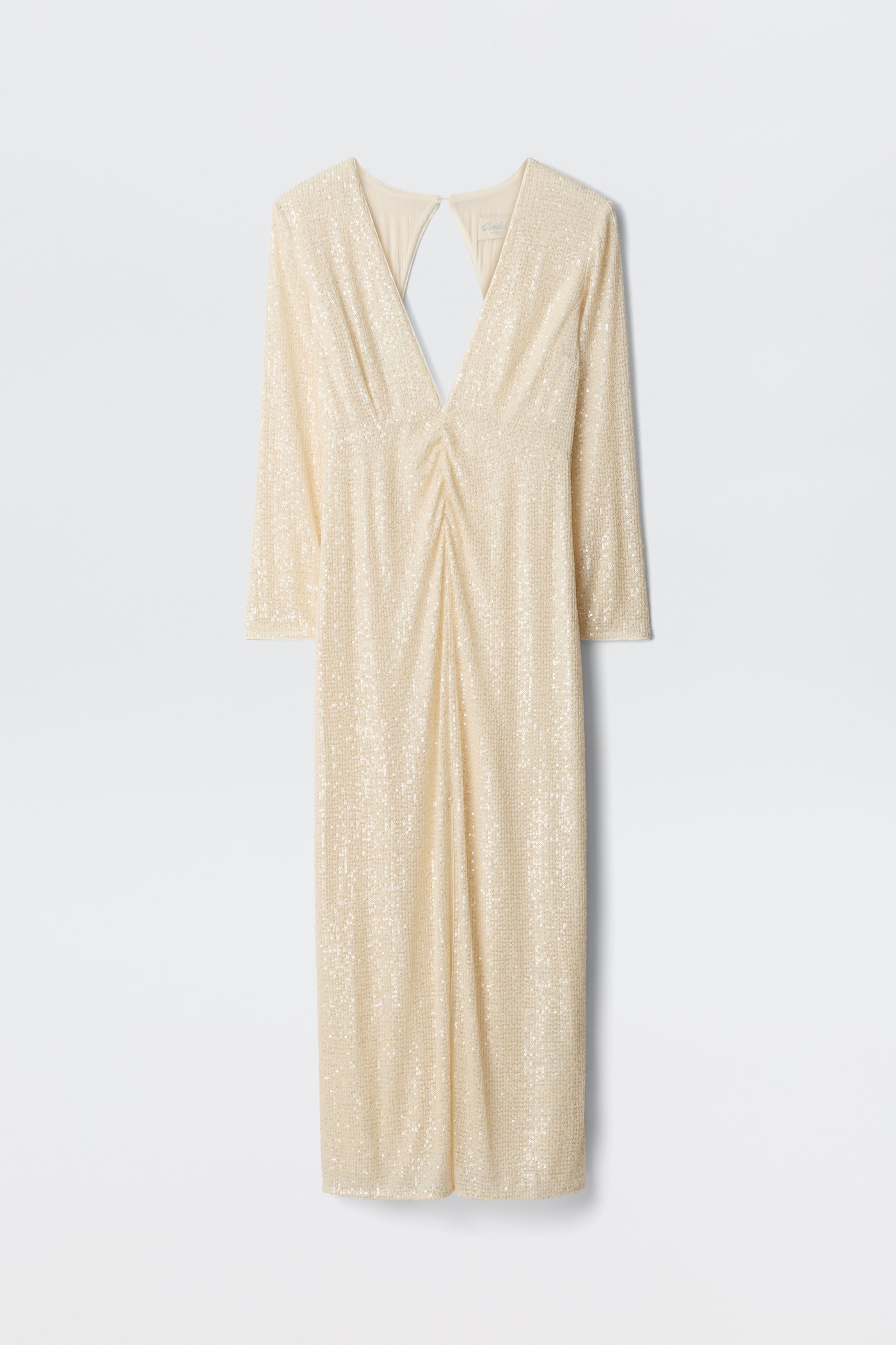 The Lorenzo - Pearl is a cream long-sleeve midi dress with sequins, a deep V-neckline, gathered waist detail, and a teardrop open back. It is displayed against a plain white background.