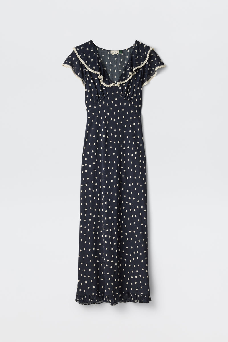 Bethea - Layla Dot Navy: Navy blue short-sleeve maxi dress with white polka dots, ruffled neckline, and hem, shown on a plain white background.