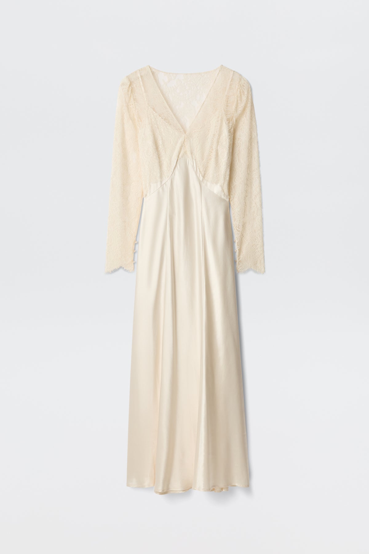 The Laoise - Pearl is an elegant cream-colored long dress with a V-neckline, long lace sleeves, a delicate lace bodice, and a flowing satin skirt with a smooth, shiny finish.