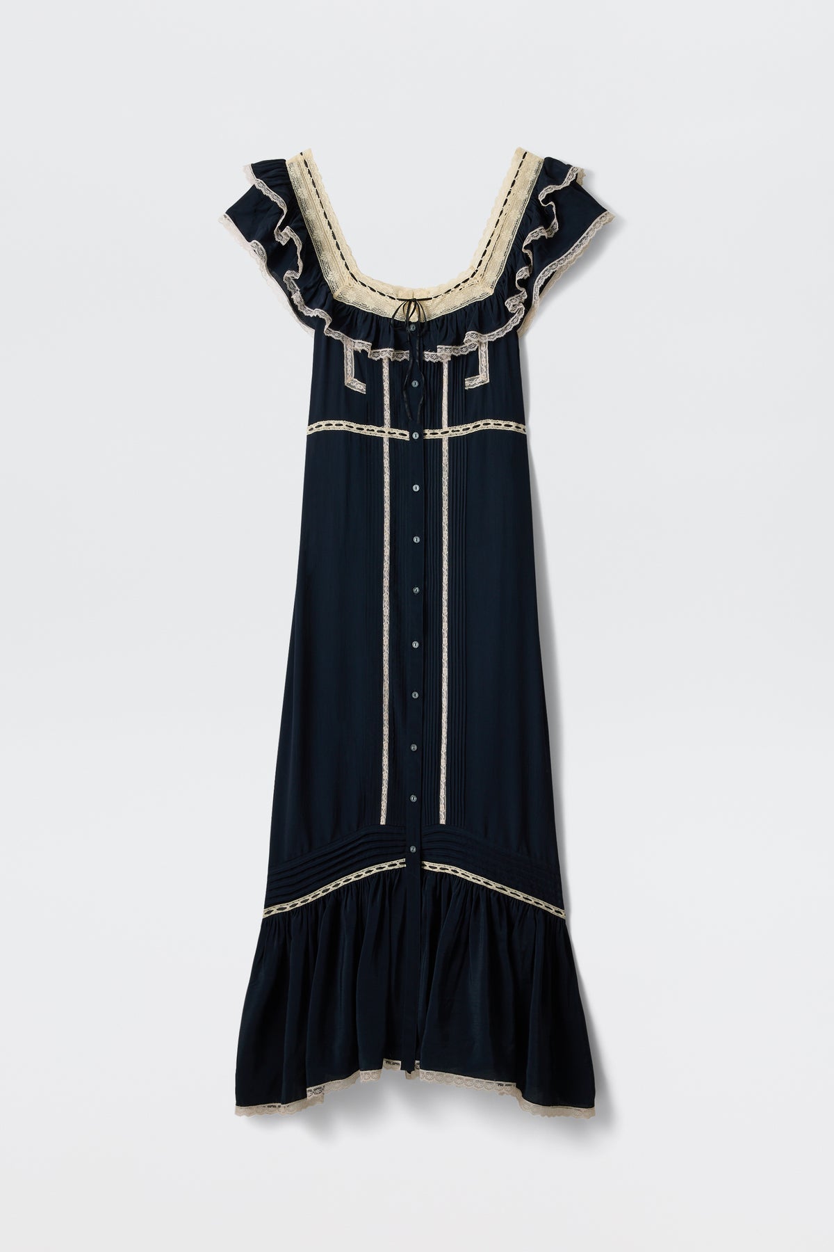 The Kendara - Deep Navy is a prairie-inspired midi dress in dark navy cotton, featuring cream lace trim, ruffled cap sleeves, a square neckline, button-down front, and flounced hem. Shown against a plain white background.