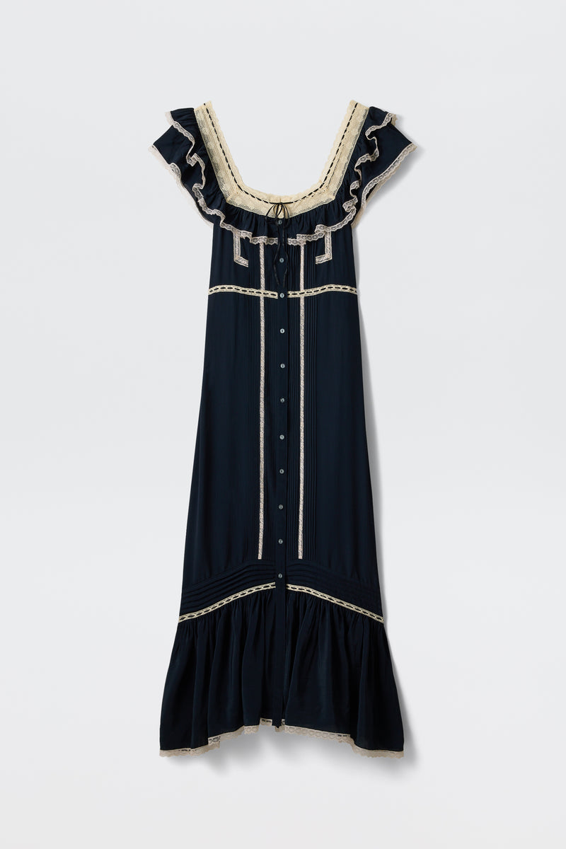 The Kendara - Deep Navy is a prairie-inspired midi dress in dark navy cotton, featuring cream lace trim, ruffled cap sleeves, a square neckline, button-down front, and flounced hem. Shown against a plain white background.