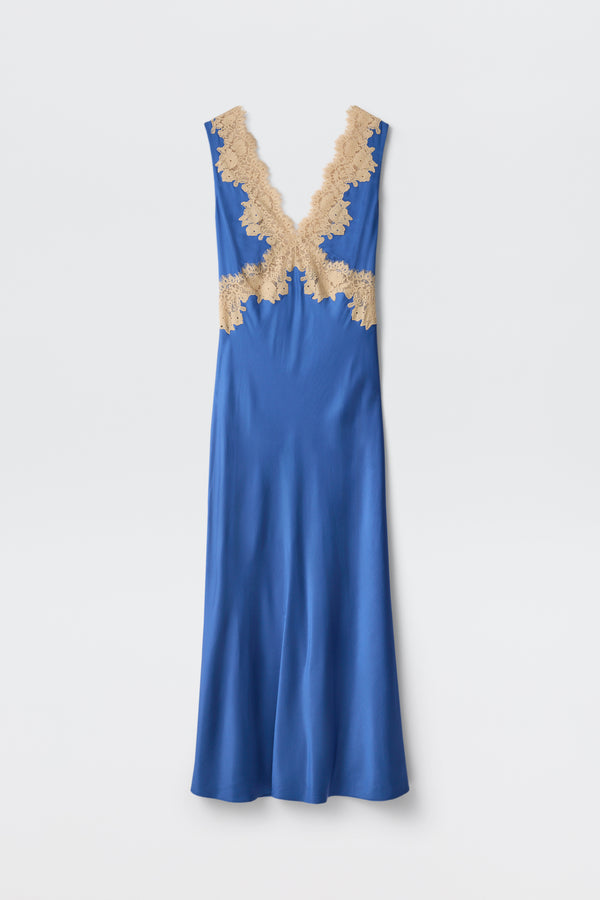 The Lysandra - Iris Blue is a long, sleeveless satin dress in royal blue, featuring a deep V-neckline with beige lace trim at the neckline and waist, presented on a plain white background.
