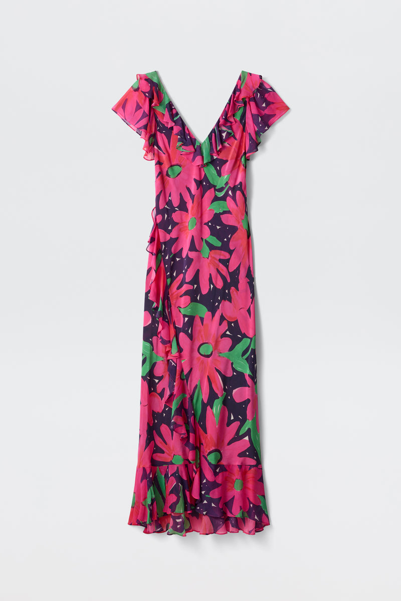 The Meadow - Danish Floral Pink maxi dress features short flutter sleeves, a V-neckline, and a vibrant pink, red, and green floral print on a dark purple background.