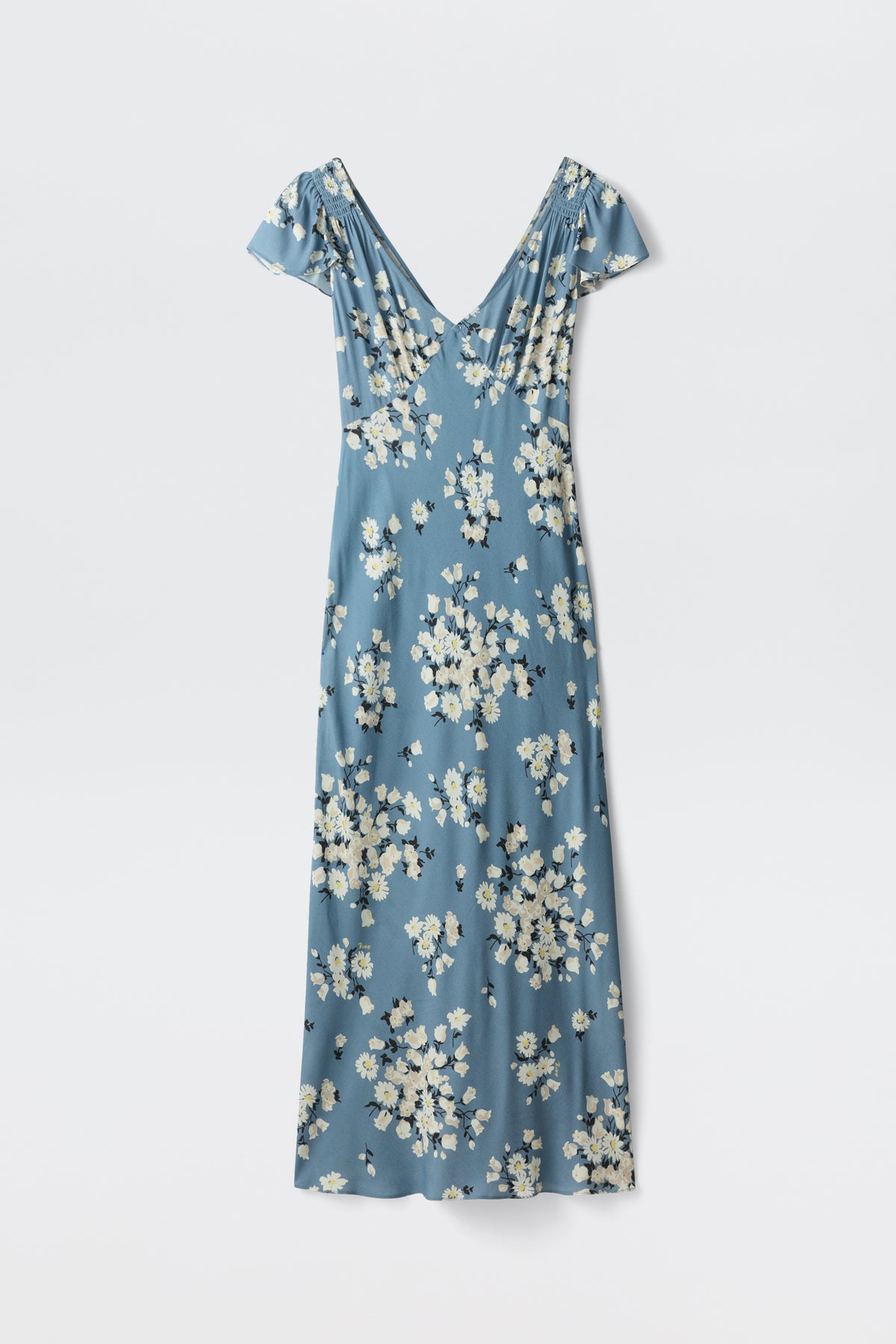 The Cathy - Amelia Bouquet Blue is a blue, short-sleeved V-neck maxi dress featuring a white and yellow floral print, shown laid flat on a white background.