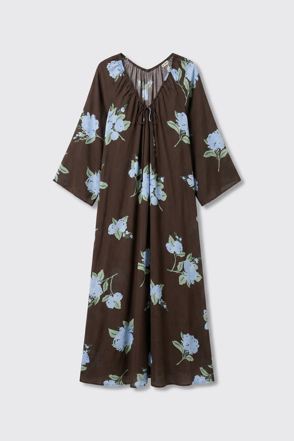 Lianne - Peonies Scatter Brown is a brown, long-sleeve, loose-fitting dress with a v-neck and drawstring, featuring a light blue and green peony floral pattern.