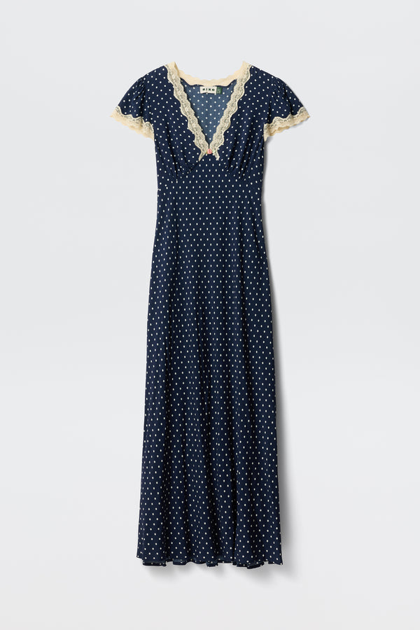 Clarice - Navy Polka Dot: A vintage-inspired, full-length rayon dress with white polka dots, short sleeves, and light beige lace trim on the V-neckline and sleeves, shown on a plain white background.