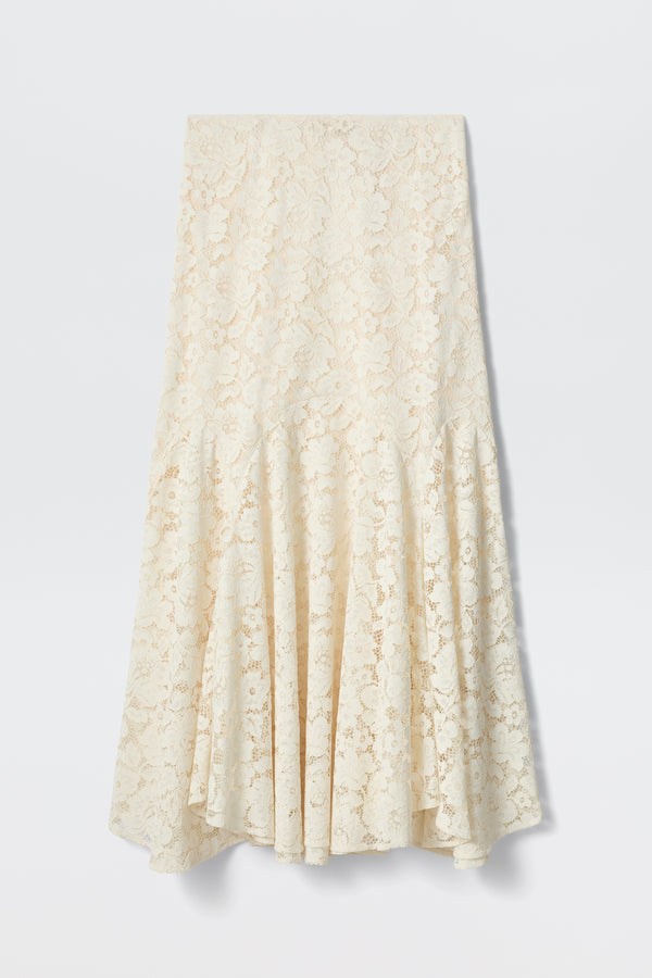 The Jada - Cream is a mid-length cream lace skirt featuring a fitted waist and flared, flowing hem, showcased against a plain white background.