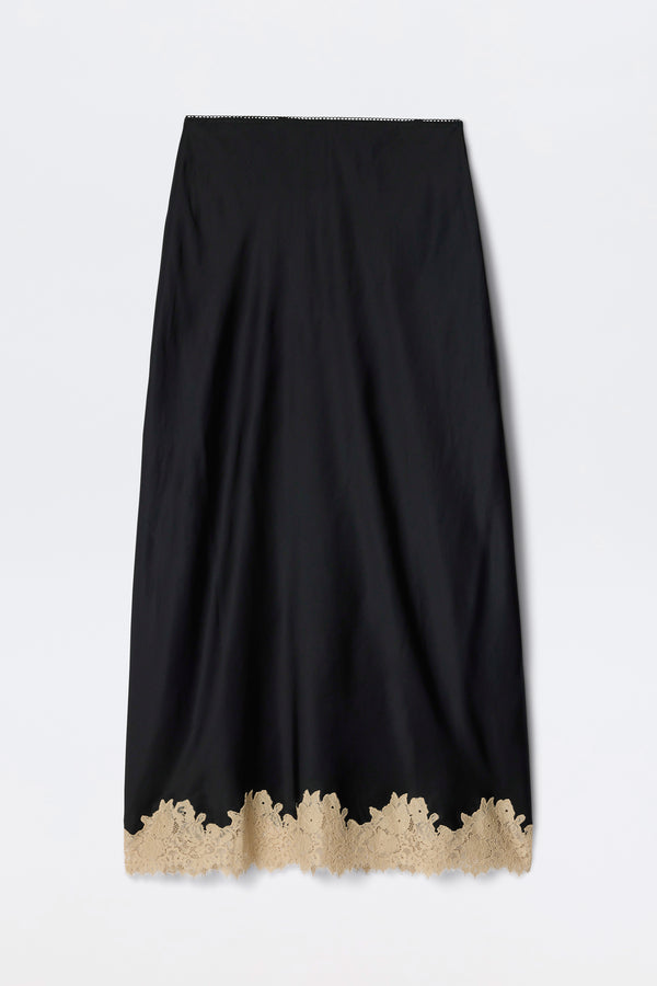 Matilde - Black: A long black skirt featuring a scalloped beige lace trim at the hem, displayed against a plain white background.