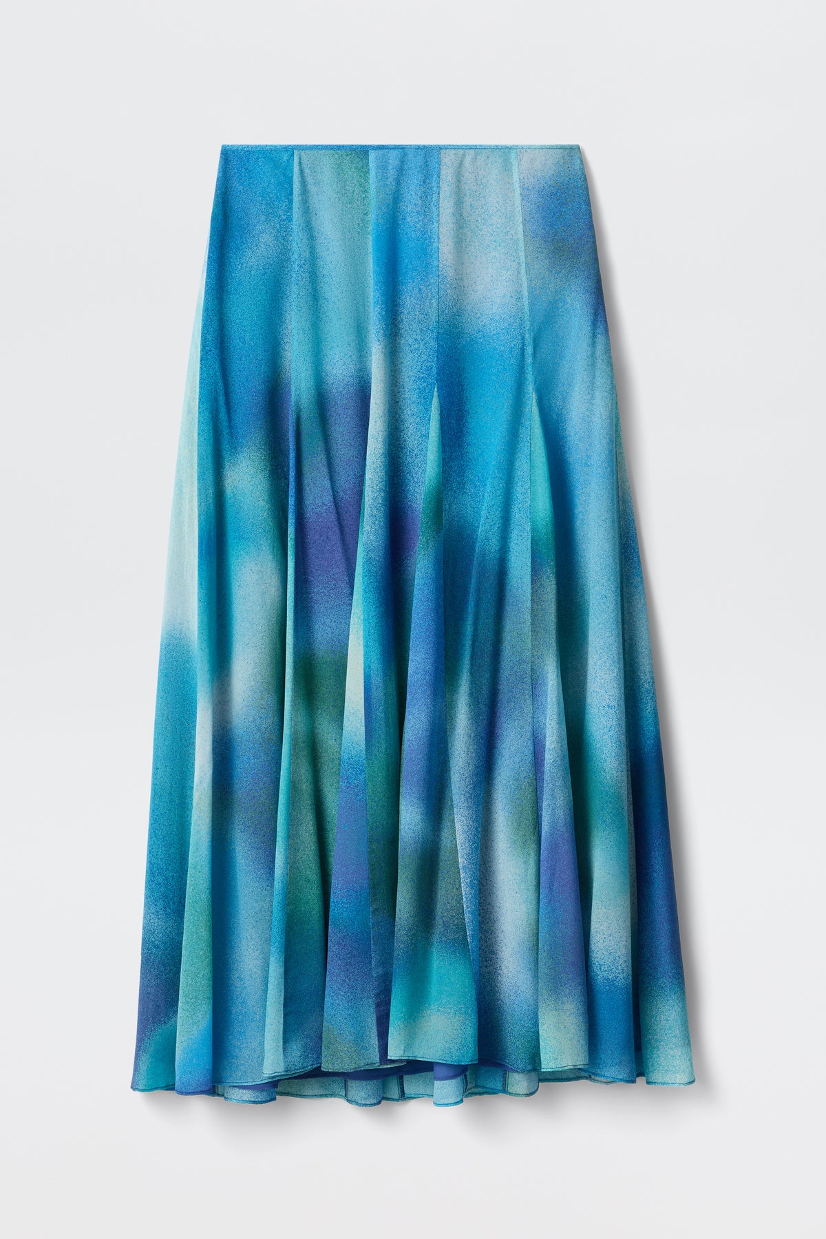 A long, pleated midi skirt named "Billy - Jessica Alexandra Blue," crafted from luxurious Liberty fabric with a blue and green watercolor pattern, perfect for spring/summer dressing, displayed against a white background.