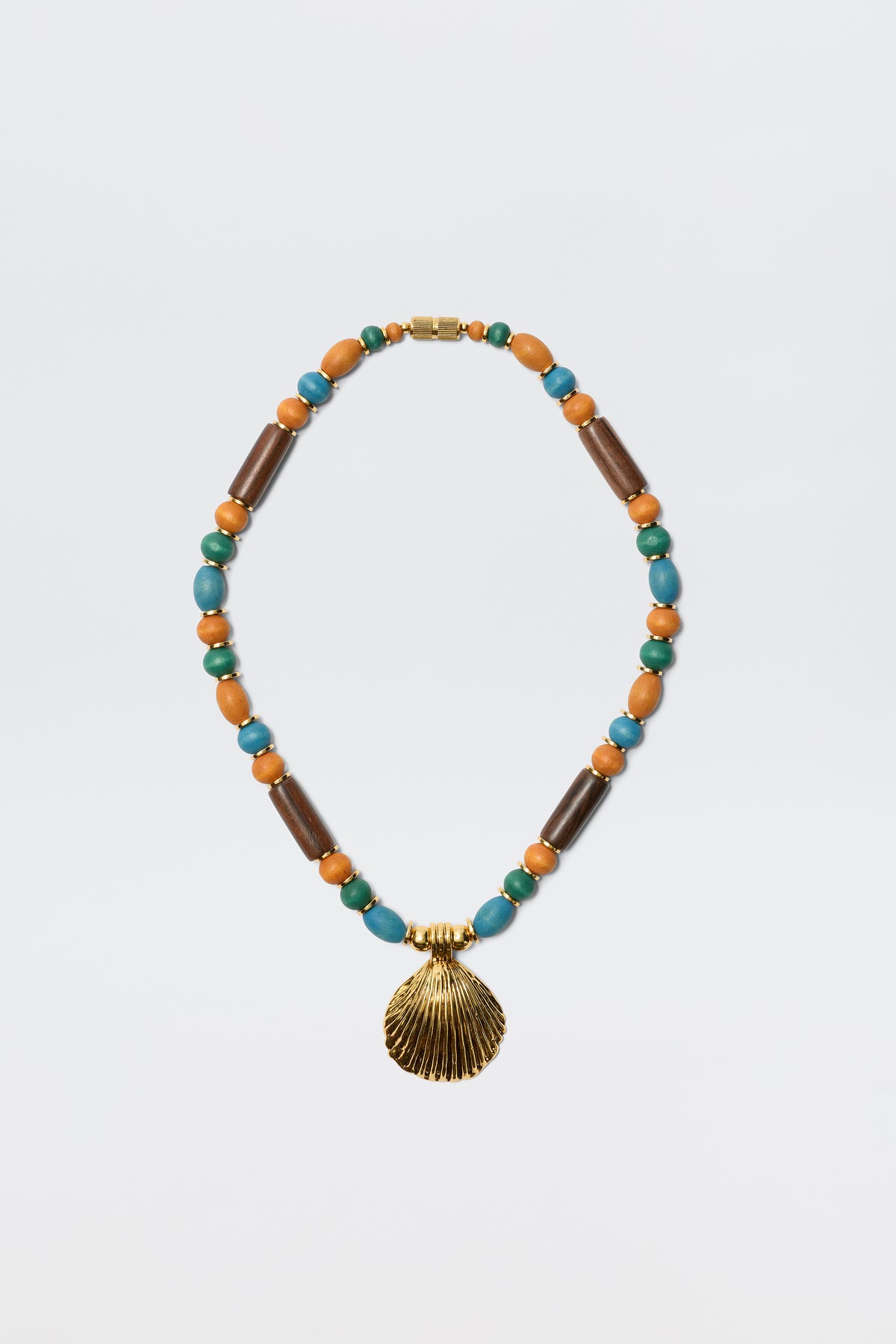 The Darielle - Multi necklace features alternating turquoise, brown wooden, and orange beads with a gold seashell pendant at the center, shown on a plain white background.