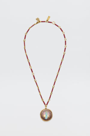 Ari - Astro Virgo: A gold and red beaded necklace featuring a round statement disc pendant adorned with a central opal-like stone, encircled by a purple and gold sunburst design, displayed on a white background.