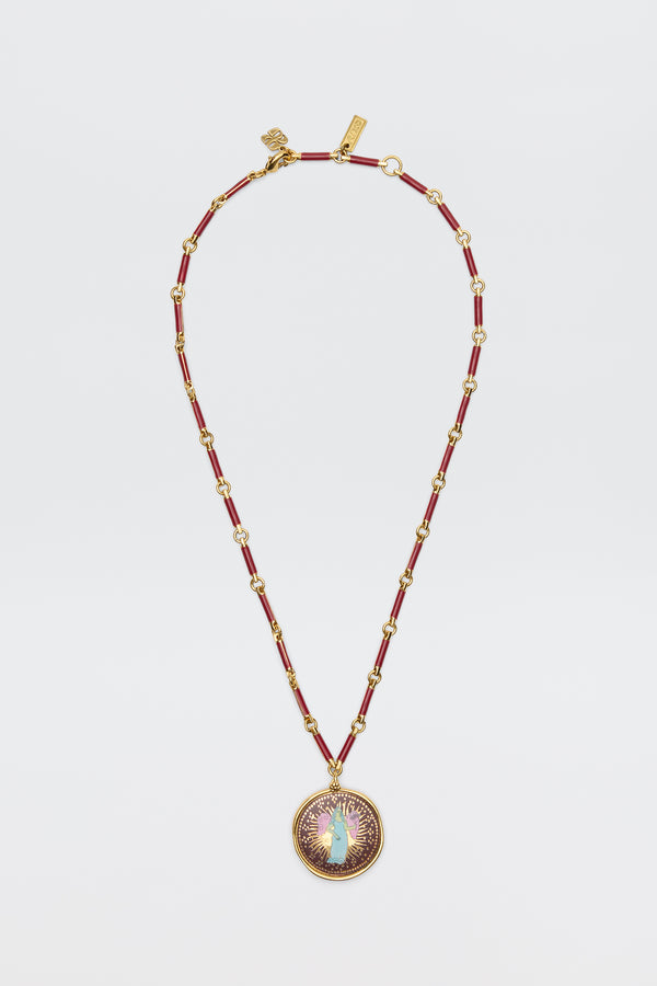 Ari - Astro Virgo: A gold and red beaded necklace featuring a round statement disc pendant adorned with a central opal-like stone, encircled by a purple and gold sunburst design, displayed on a white background.