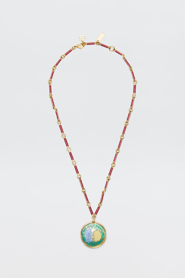 Ari - Astro Taurus: Gold chain necklace with red enamel links and a round pendant featuring a vibrant floral design, shown on a white background—a stylish zodiac accessory for any occasion.