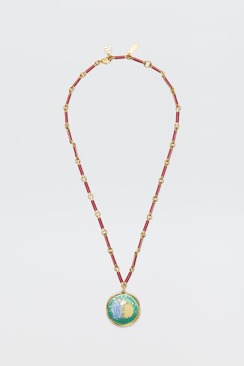 Ari - Astro Taurus: Gold chain necklace with red enamel links and a round pendant featuring a vibrant floral design, shown on a white background—a stylish zodiac accessory for any occasion.