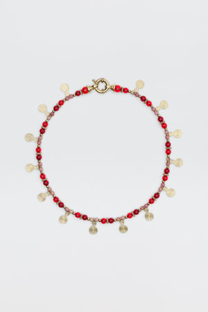 The Tala - Burgundy necklace features alternating red and pink beads with small gold spiral charms hanging evenly, shown on a white background.