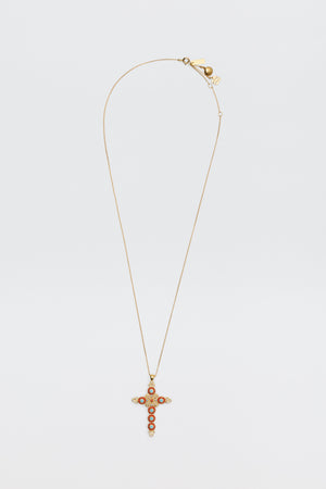 The Lenka - Gold necklace features a gold chain with a cross pendant embellished with red and clear stones, shown against a plain white background.