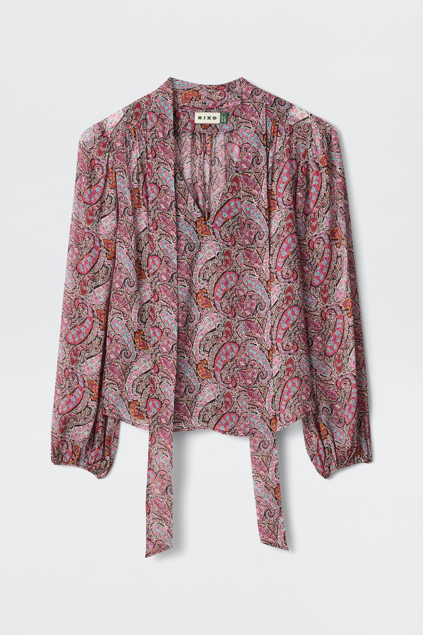 A long-sleeve Moss - Bourton Red georgette blouse with a pink, red, and purple paisley pattern, featuring a tie-front and slight gathering at the shoulders, displayed against a white background.