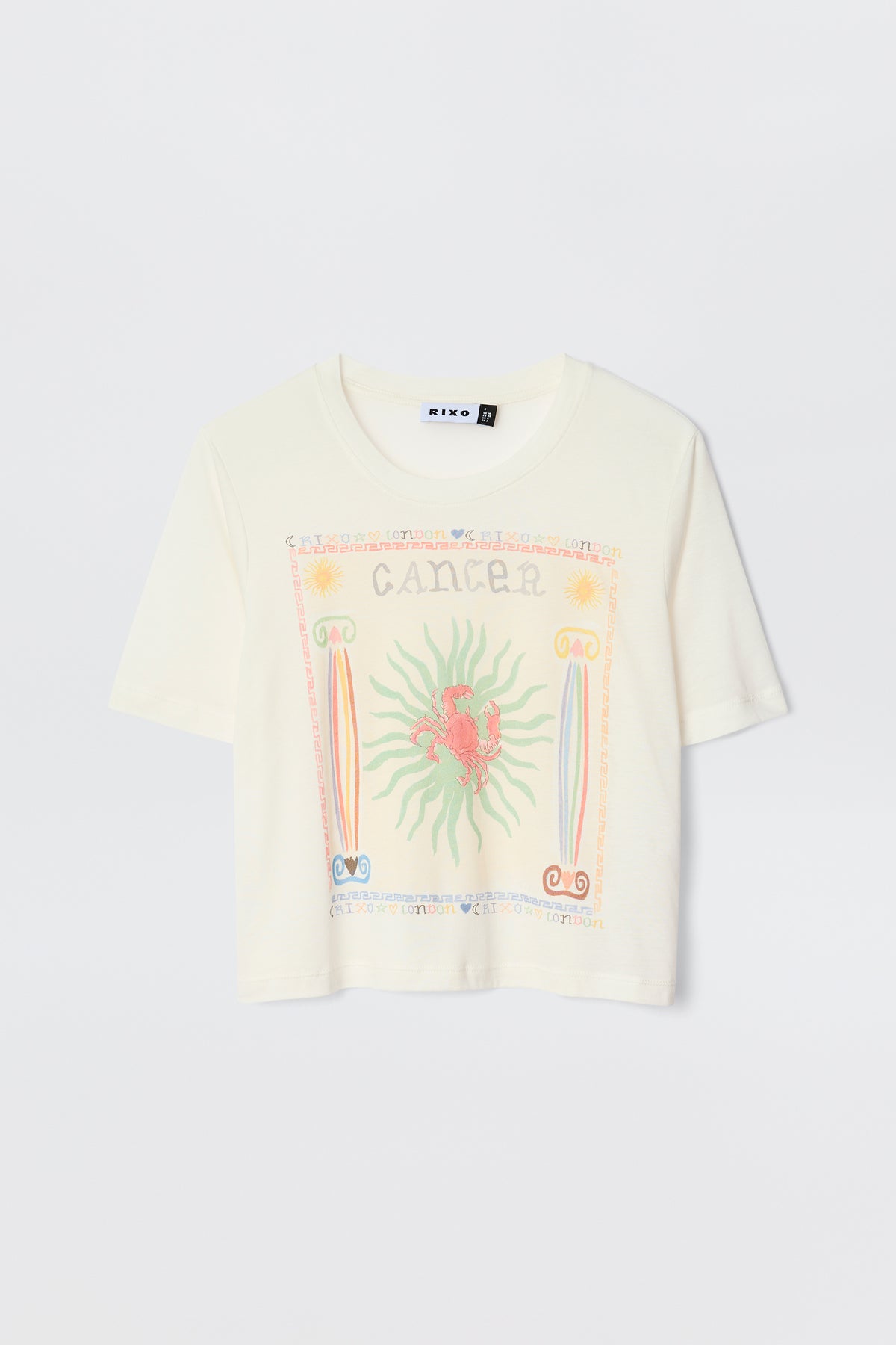 The Ria - Cancer T-shirt is a white short-sleeve top with a vibrant red crab Cancer illustration, pastel border designs, and "Cancer" text—perfect to pair with playful RIXO skirts.