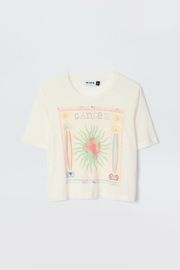 The Ria - Cancer T-shirt is a white short-sleeve top with a vibrant red crab Cancer illustration, pastel border designs, and "Cancer" text—perfect to pair with playful RIXO skirts.