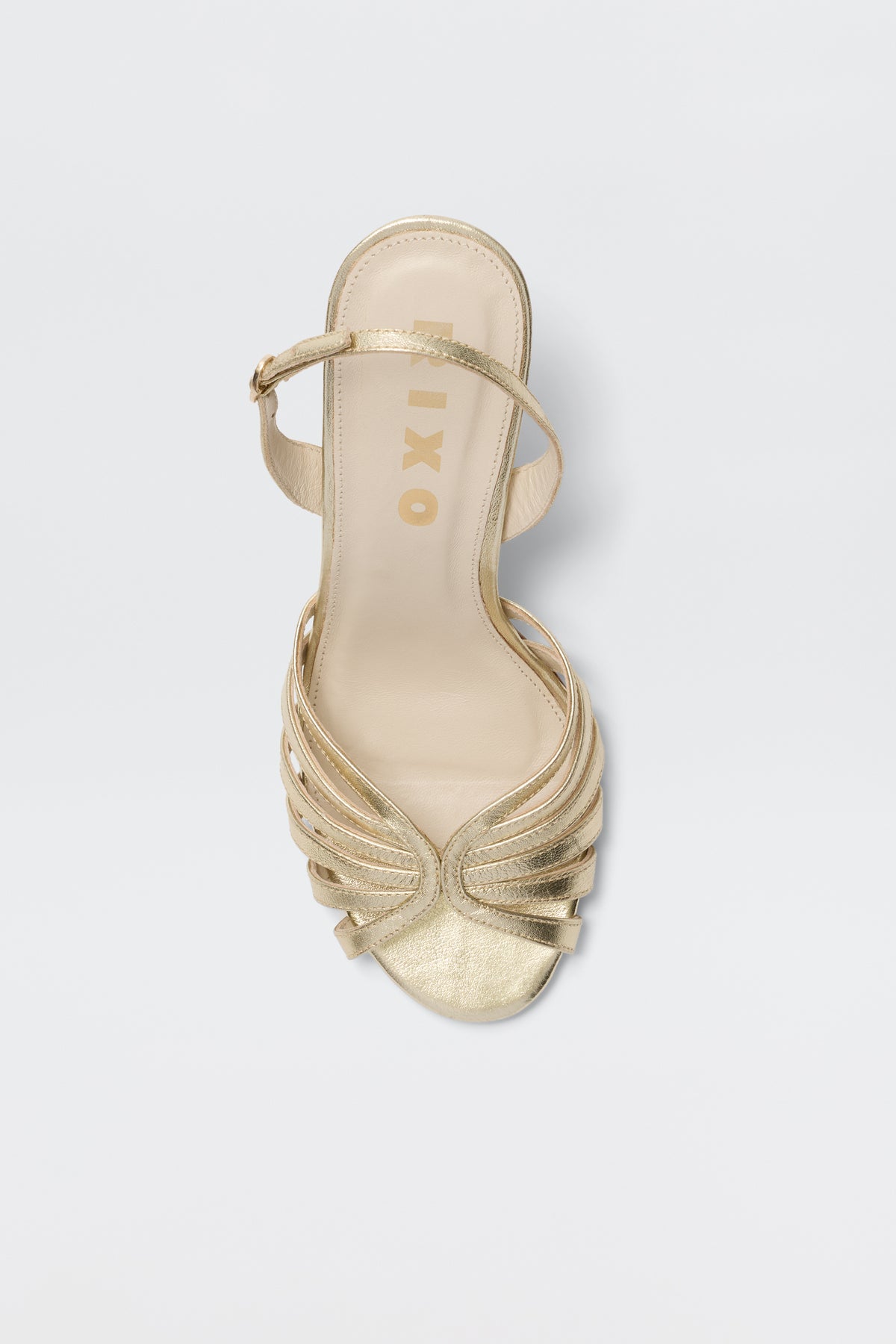 The Mavi - Gold sandal, with a strappy open-toe design and ankle strap, is shown from above on a white background. Its insole features "OXXO" in gold lettering—an elegant choice for women's footwear collections.