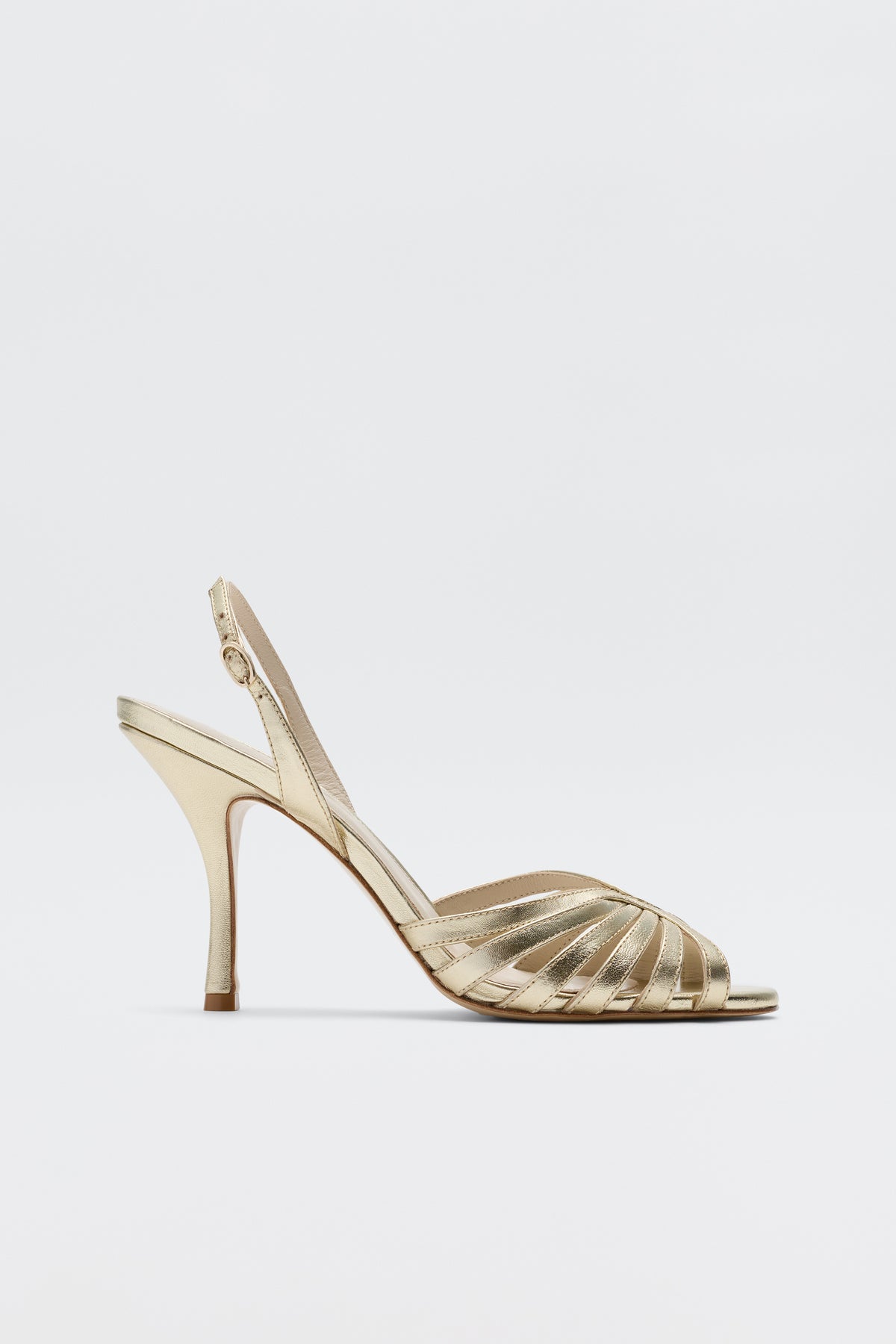 The Mavi - Gold high-heeled sandals for women feature a glamorous strappy open-toe design with an adjustable slingback strap, shown on a plain white background.