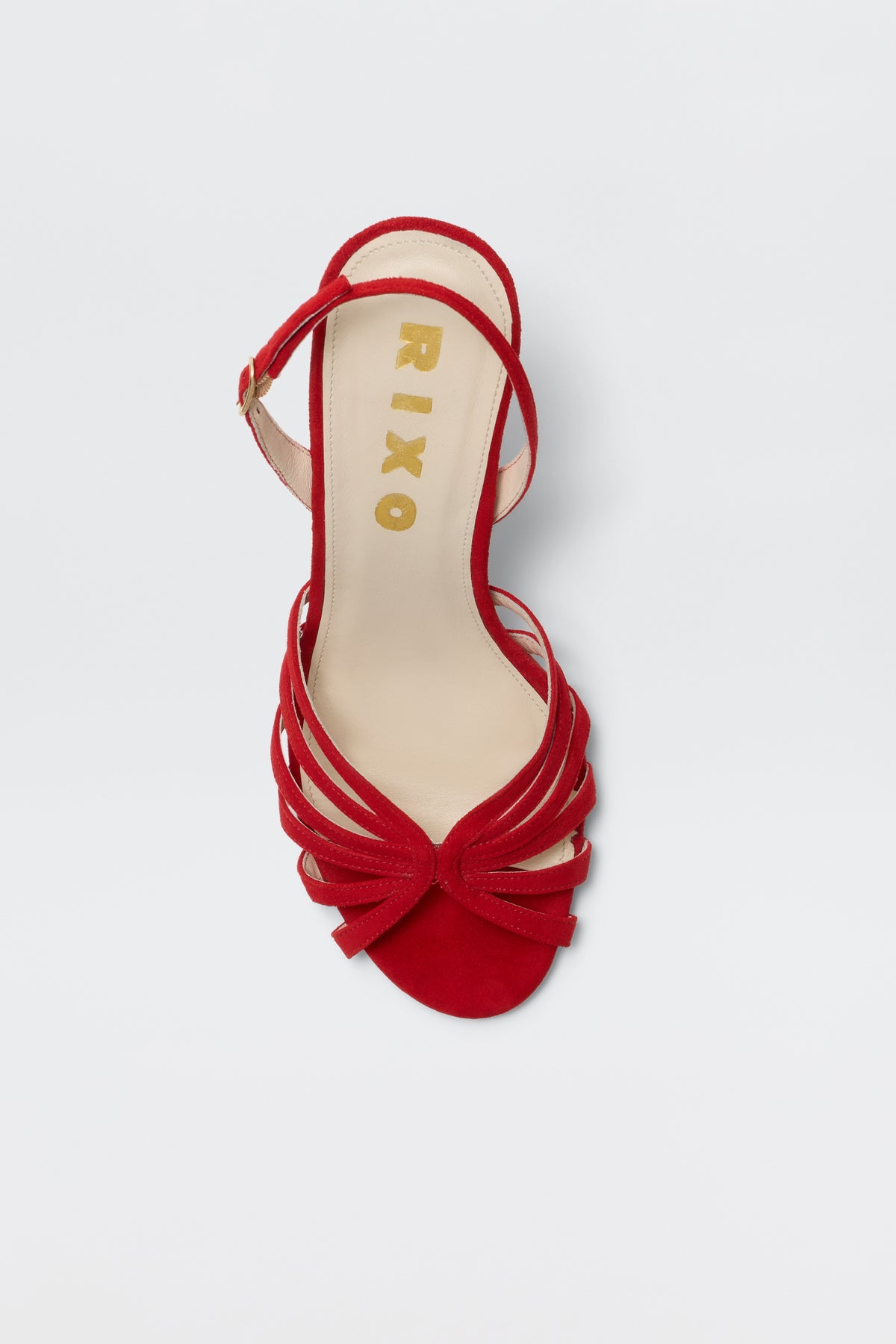 The Mavi - Red is a single red sandal with multiple thin straps and a small knot detail at the front, featuring RIXO in gold lettering on the beige insole—an elegant addition to any women's footwear collection.