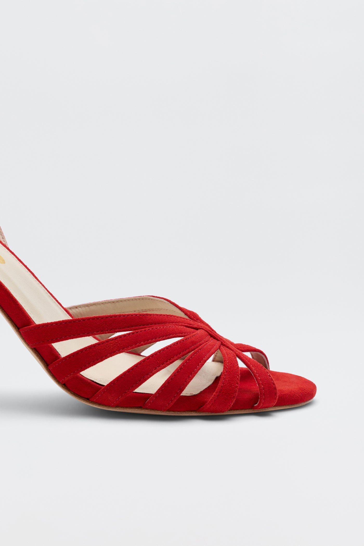 The Mavi - Red is a strappy high-heeled sandal with an open toe and crisscross design, shown from the side against a plain light background—perfect for adding glamour to your look.