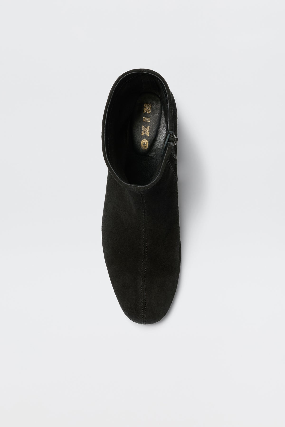 Top view of the Rey - Black suede ankle boot with a feminine heel and visible REISS logo on the insole, displayed against a plain white background.