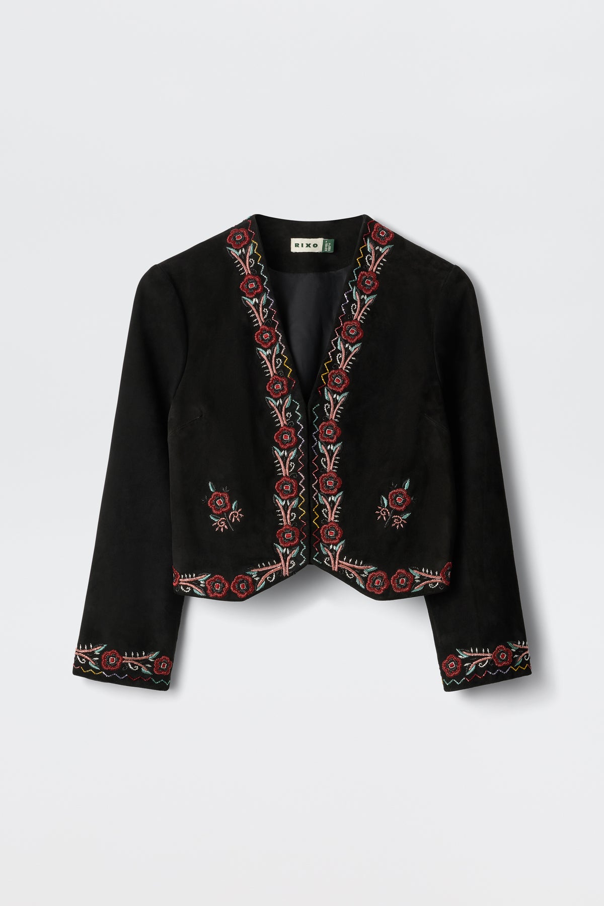 Oliwia - Roselle Embellishment Black: A black cropped jacket with long sleeves, showcasing red and cream floral embroidery along the edges, cuffs, and hem. Features an open front design and is displayed on a white background.