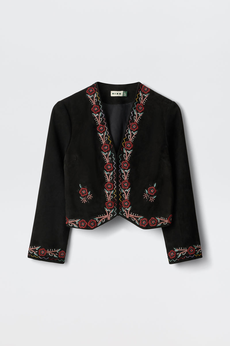Oliwia - Roselle Embellishment Black: A black cropped jacket with long sleeves, showcasing red and cream floral embroidery along the edges, cuffs, and hem. Features an open front design and is displayed on a white background.