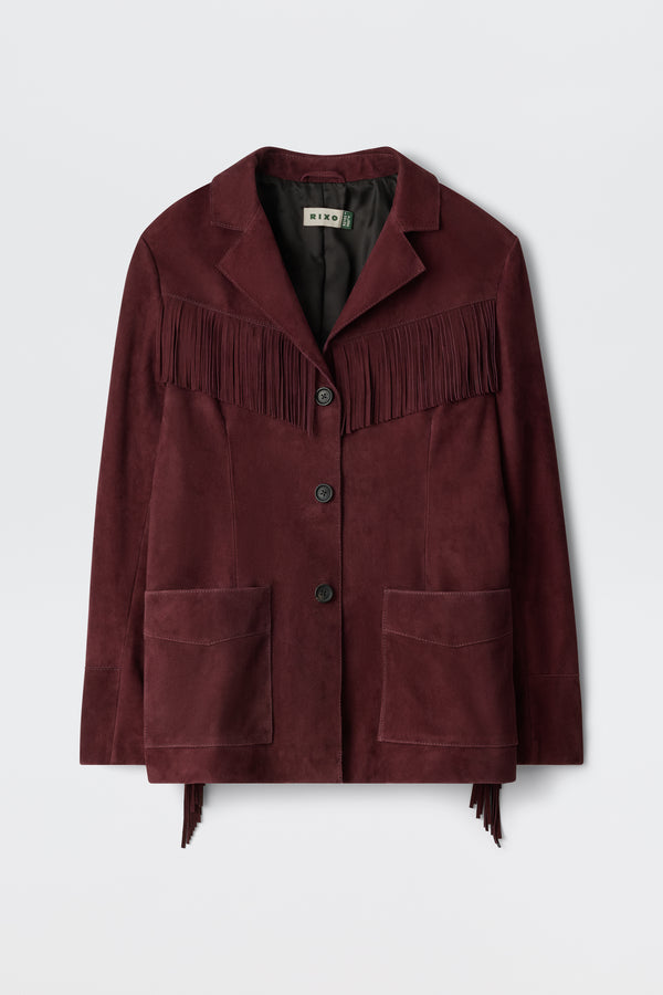 The Teagan - Maroon is a suede jacket featuring fringe across the chest and back, a notched collar, three buttons, two large front pockets, and a relaxed fit.