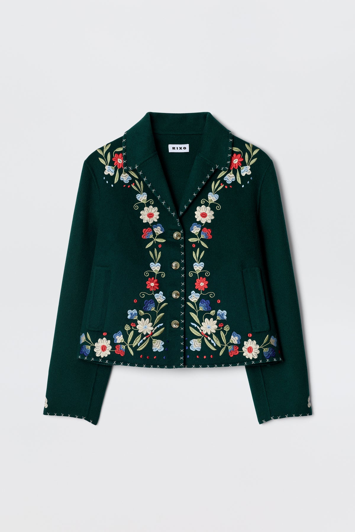 The Jude - Bliss Embroidery Green jacket by RIXO is a dark green, cropped piece with vibrant embroidery on the front, lapels, and cuffs, finished with decorative metallic buttons.