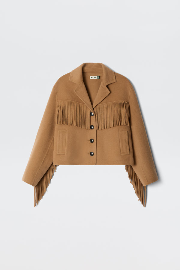 The Ashleigh - Camel is a tan cropped jacket with fringe on the chest, sleeves, and hem, buttoned front, and notched collar, shown against a plain white background.