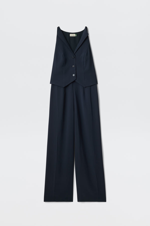The Sienna 2 - Navy is a sleeveless jumpsuit in dark navy, featuring a button-up vest-style top and wide-leg pants, displayed on a white background.