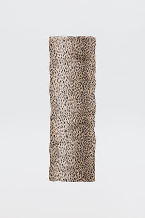 The Julien Scarf Antelope Spot Black features a rectangular crinkled-georgette fabric with a beige base and black irregular antelope spots, shown on a plain white background—perfect for expressing your wild side.