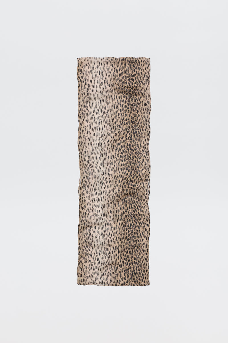 The Julien Scarf Antelope Spot Black features a rectangular crinkled-georgette fabric with a beige base and black irregular antelope spots, shown on a plain white background—perfect for expressing your wild side.