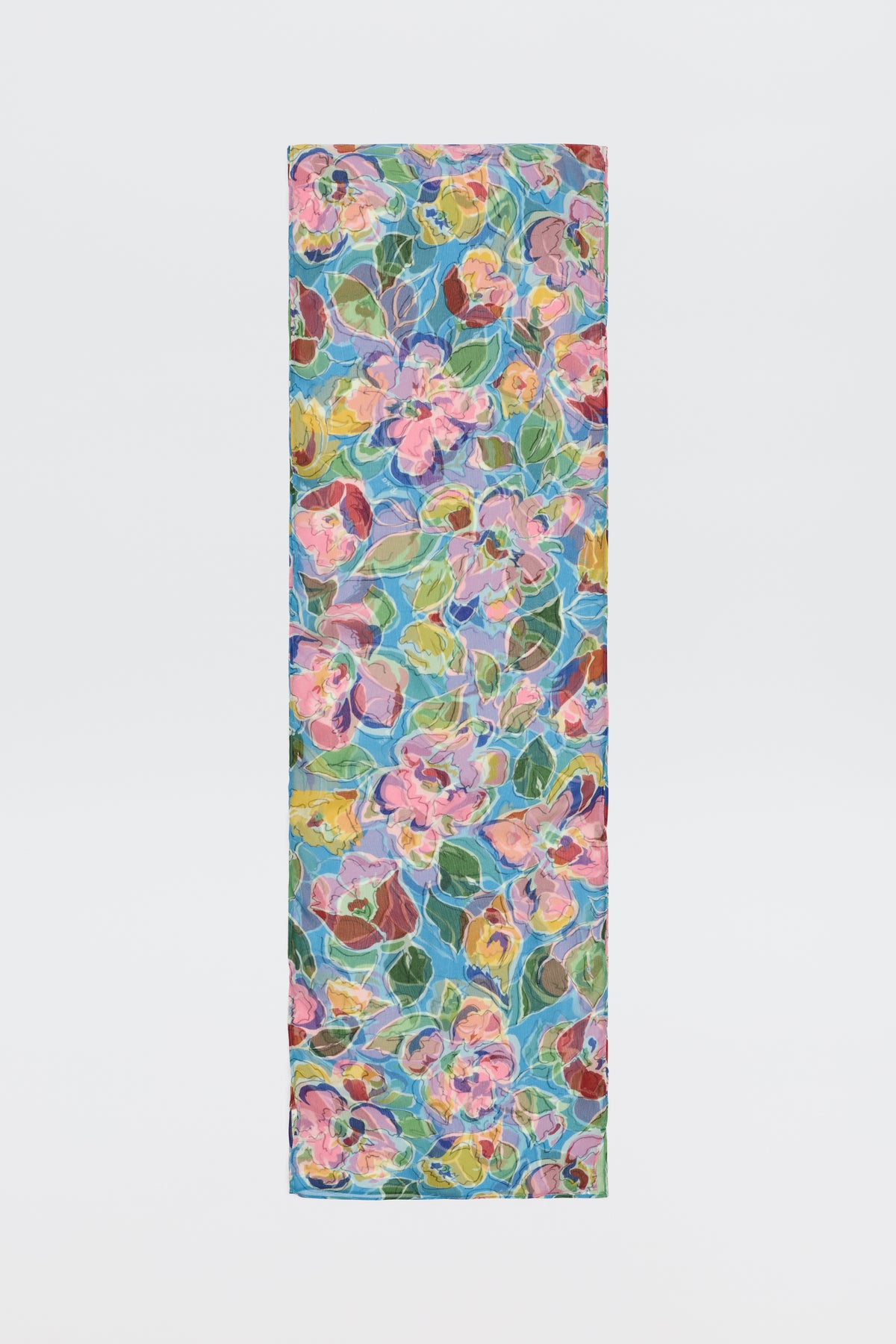 The Julien - Jeannie Bloom Sky is a rectangular yoga mat showcasing a vibrant floral pattern with pink, yellow, and blue flowers plus green leaves on a light, multicolored background.