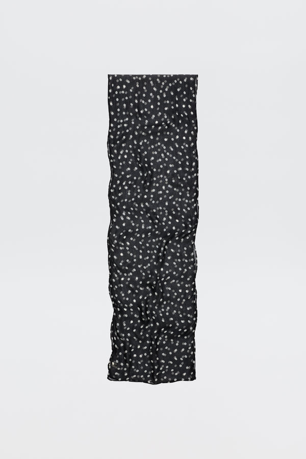 The Julien - Emma Spot Deep Navy scarf is long and black with a soft, quilted texture and small white floral spots, shown against a plain white background.