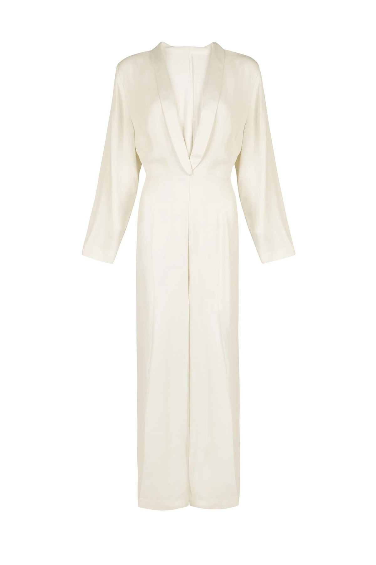 The “emilia - ivory” is a seventies-inspired, long-sleeve, full-length jumpsuit with a plunging V-neckline, wide-leg trousers, and a minimalist tailored design in cream, shown against a plain white background.