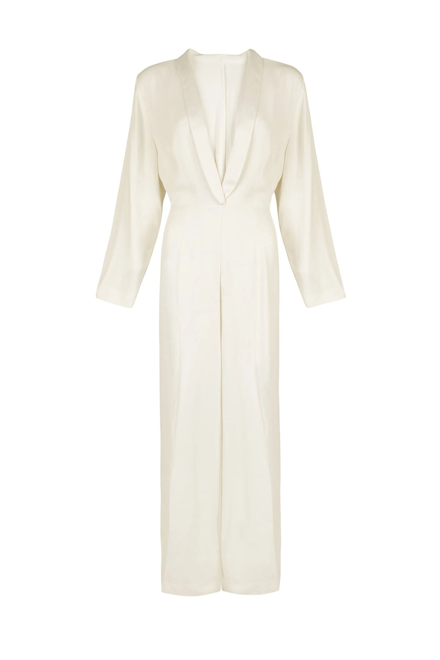 The “emilia - ivory” is a seventies-inspired, long-sleeve, full-length jumpsuit with a plunging V-neckline, wide-leg trousers, and a minimalist tailored design in cream, shown against a plain white background.