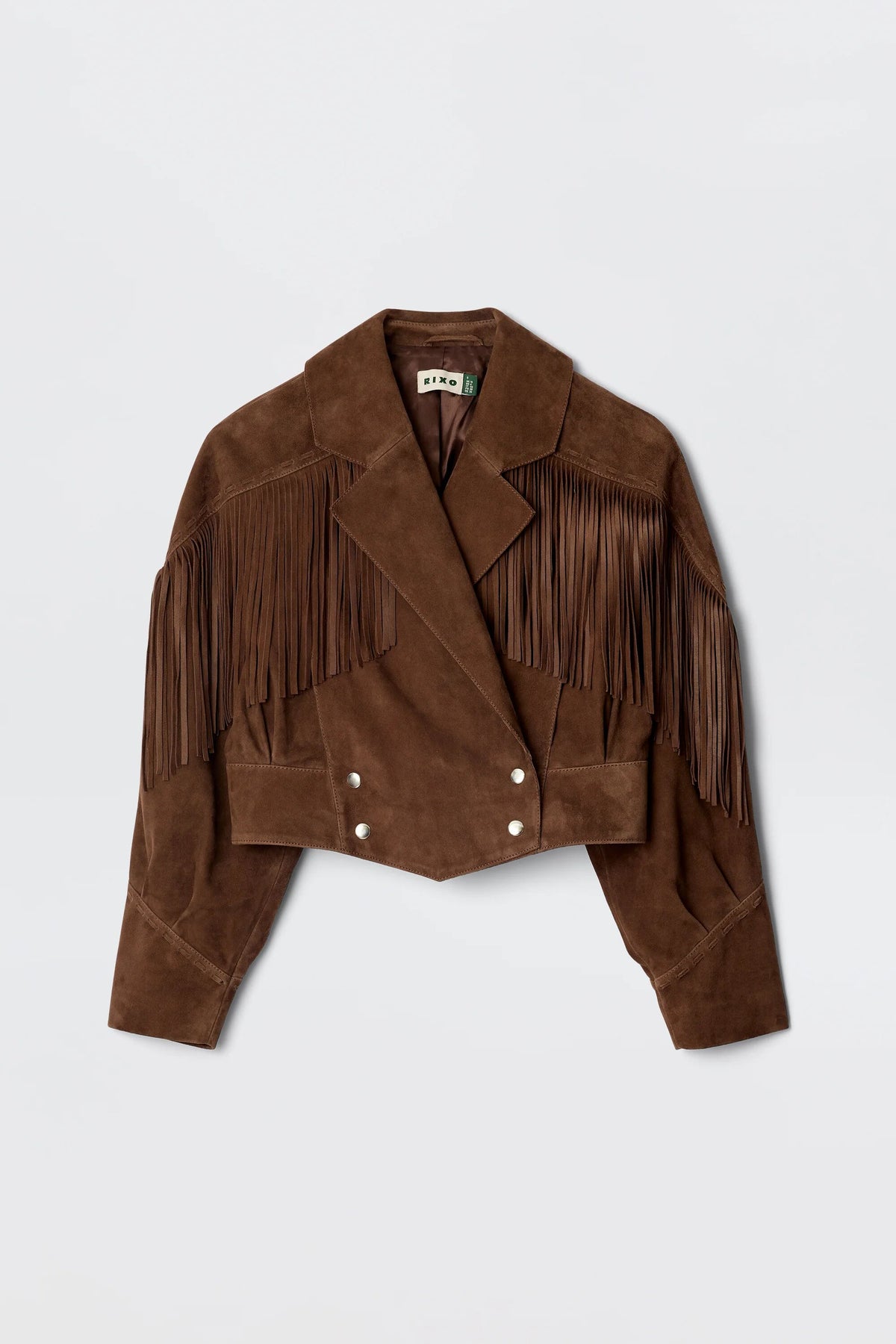 The Darragh - Brown is a 1970s-inspired suede jacket featuring a chocolate hue, wide lapels, fringe detailing on shoulders and sleeves, and front silver snap buttons.