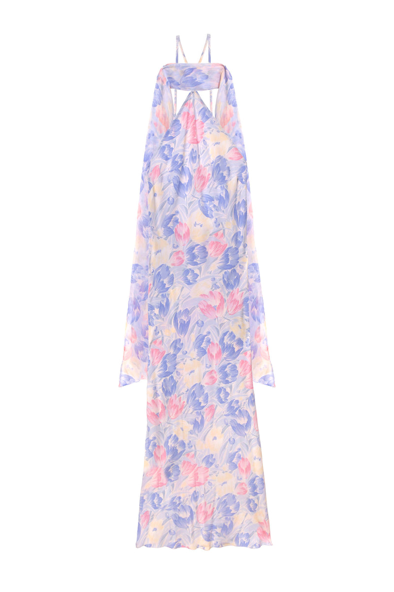 The Hayley – Tulip Fields Blue dress is a long, sleeveless silk crepe de chine halter with a flowy pastel floral print and a detachable georgette scarf for an elegant touch.