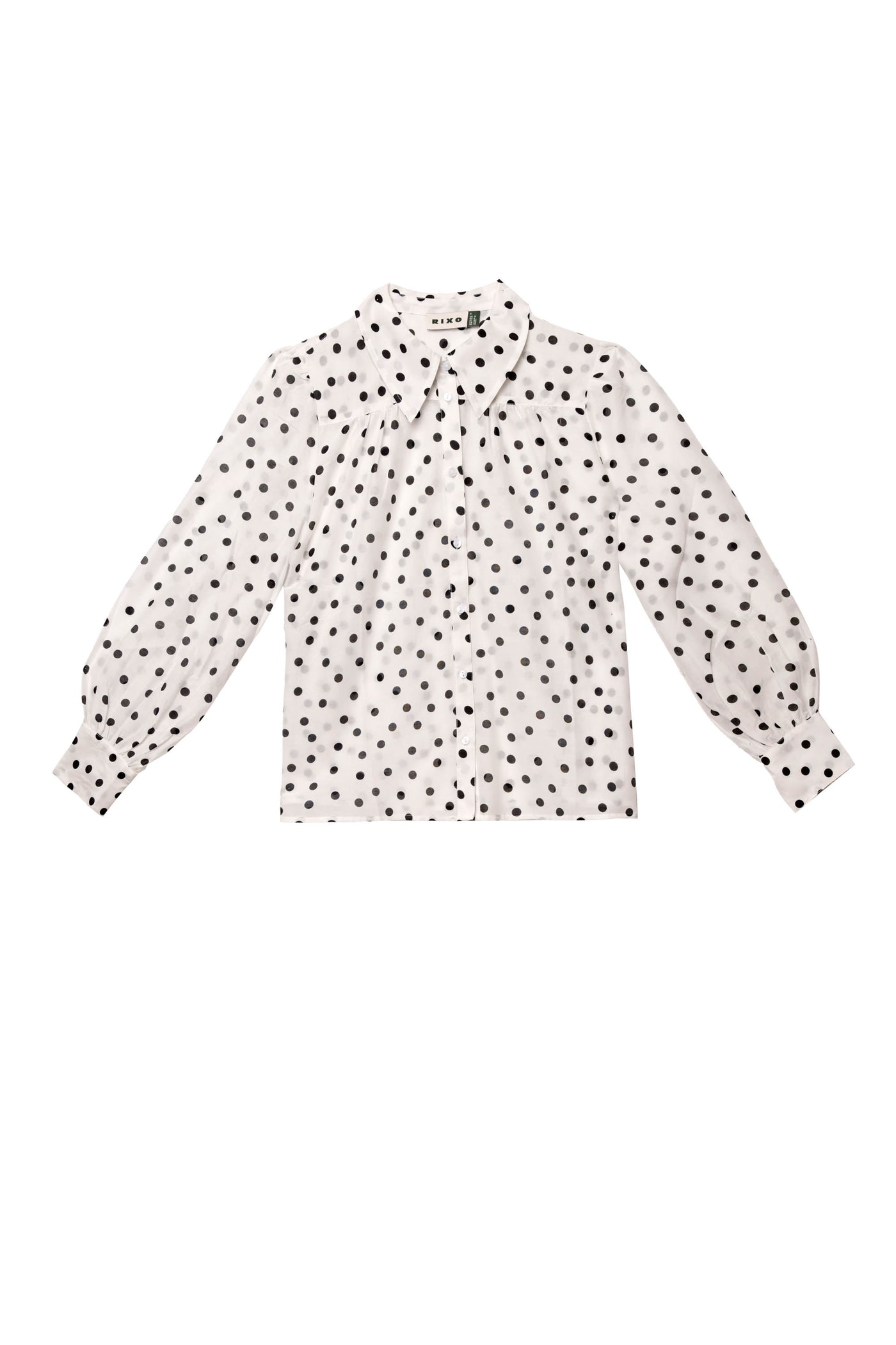 Blake - Bohemia Spot Top: white cotton-voile long-sleeve shirt with black polka dots, exaggerated collar, button-up front, and cuffed sleeves shown laid flat on a white background.