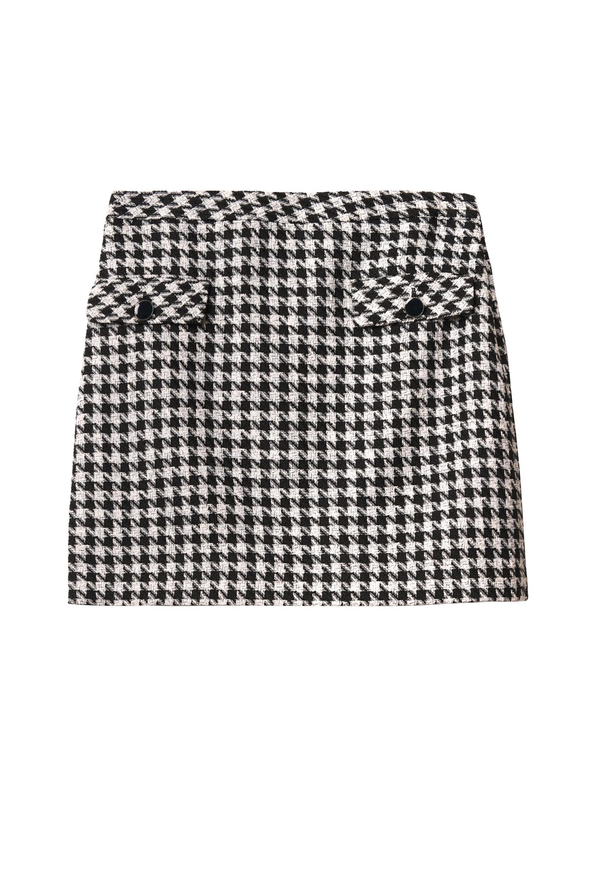 The Mariah - Houndstooth Mono is a noughties-inspired mini skirt with two front flap pockets, each finished with a black button, shown on a white background.